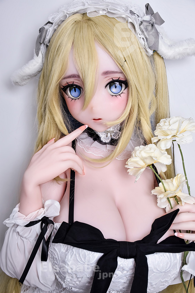 Anime-style doll with blonde hair and blue eyes in a black-and-white maid outfit, holding white flowers.