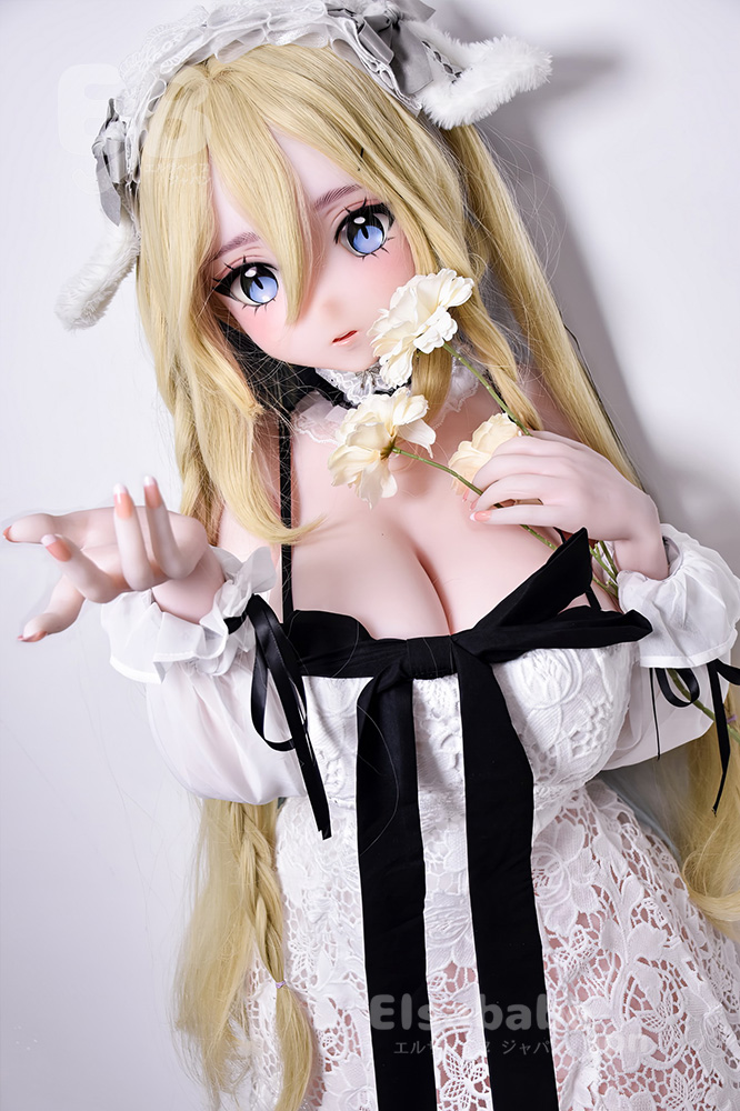 Cosplay doll with long blonde hair in a white lace dress, holding pale flowers and gazing with blue eyes at the viewer.