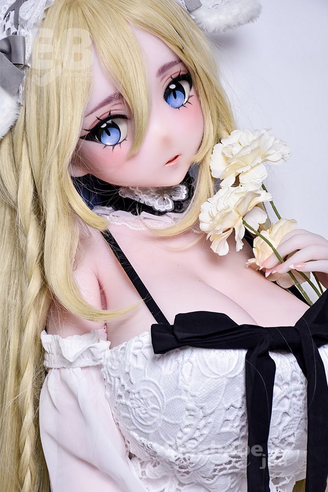 Anime-style doll with blue eyes and long blonde hair in a white lace dress, holding white flowers.