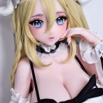 Life-like anime doll with blonde hair and blue eyes, wearing a lace headpiece and black‑and‑white lingerie, posed with hand near its face.