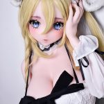 Life-like anime-style doll with blonde hair and blue eyes, wearing a white lace cosplay outfit with a black bow.