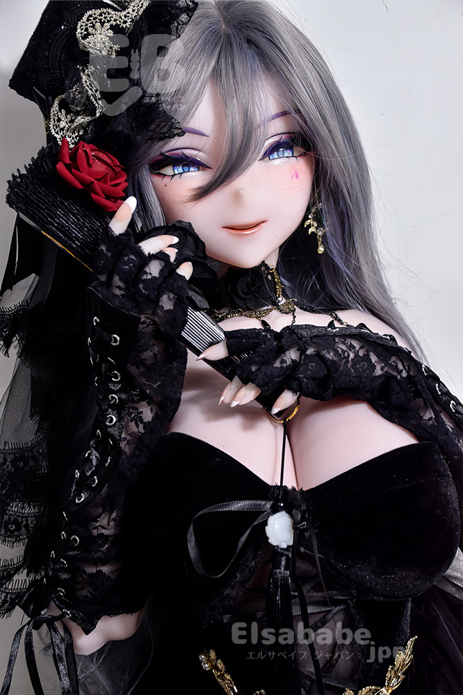 Gothic fashion doll with silver hair, blue eyes, and black lace clothing, posing with lace gloves and a red rose accent.