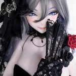 Close-up of a ball-jointed doll with silver hair and blue eyes, wearing black lace clothing, gloves, and a lace fan.