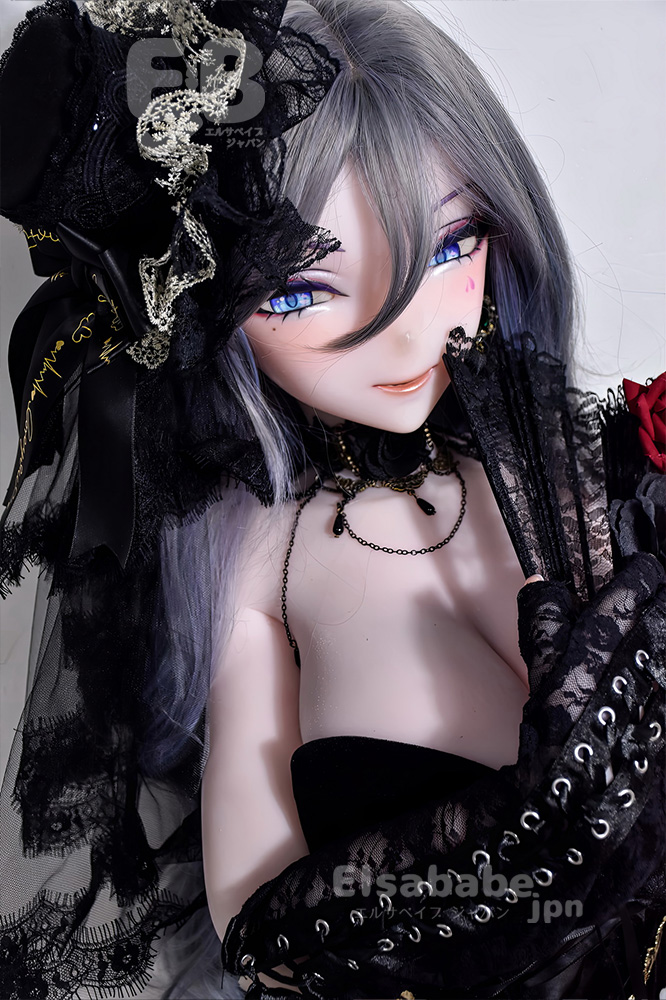 Gothic doll with silver-gray hair and bright blue eyes, wearing black lace clothing and jewelry, close-up portrait.