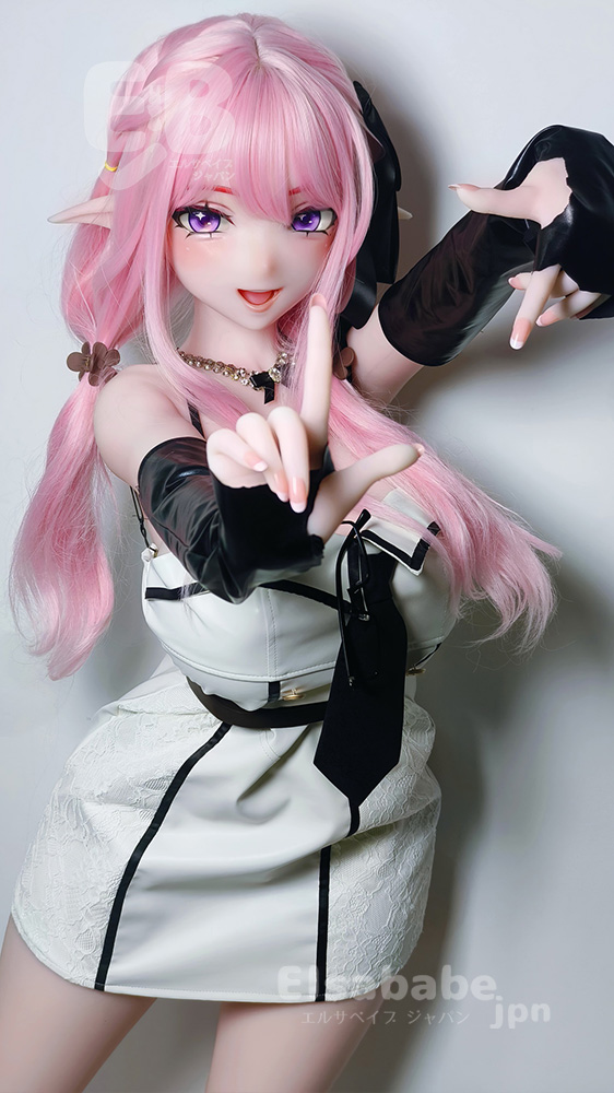 Cosplay doll with pink hair and elf ears, wearing a white and black dress, posing with hands reaching toward the camera.